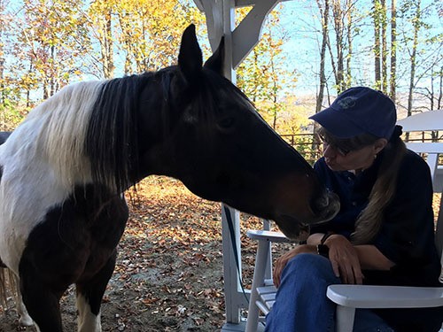 Image of Nancy kissing on Jesse at the swing
